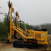 Track-mounted percussion drilling unit